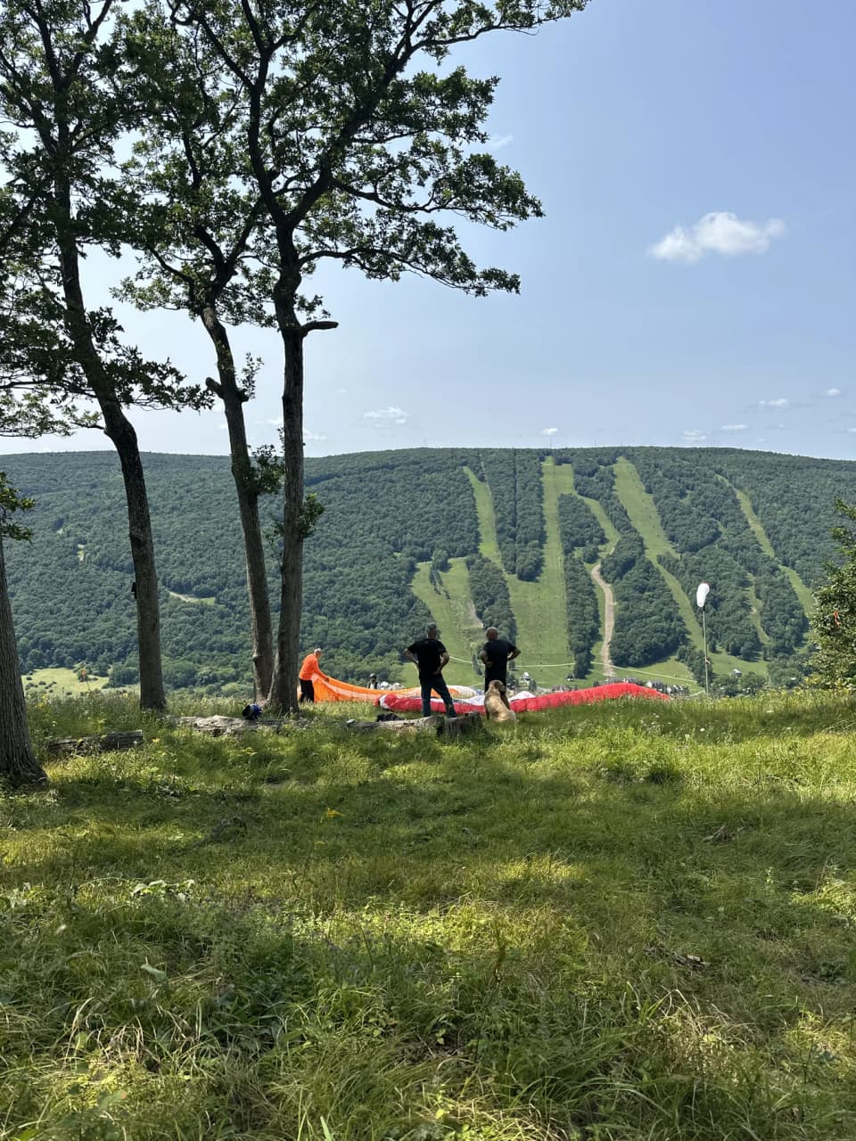 Pilots and wings gathered at Bristol launch with Bristol Mountain across the valley