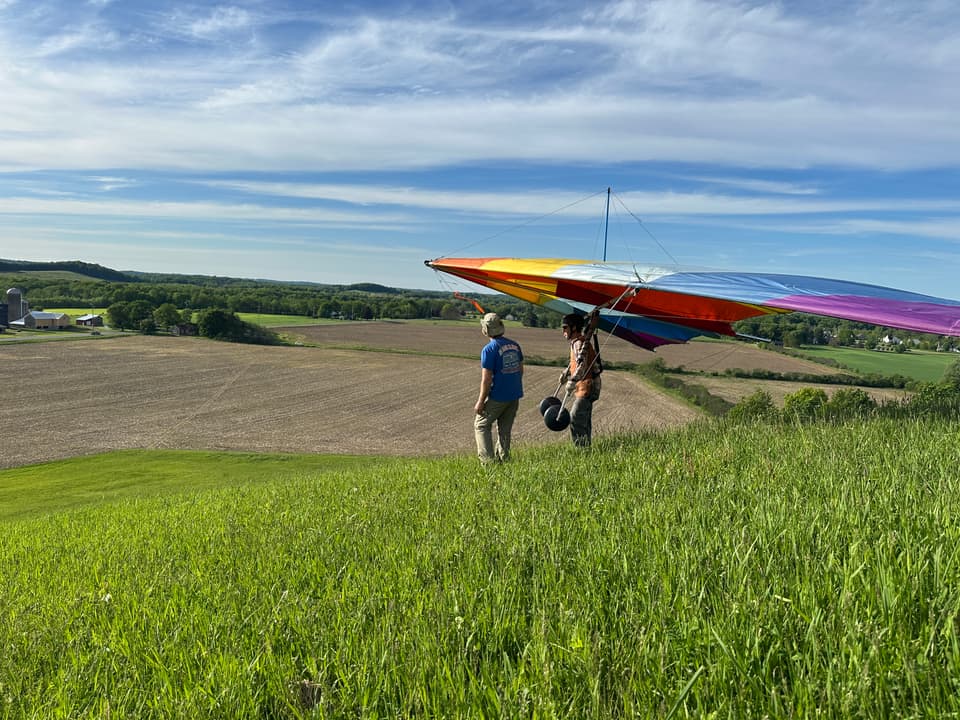 Pilot preparing on a grassy launch